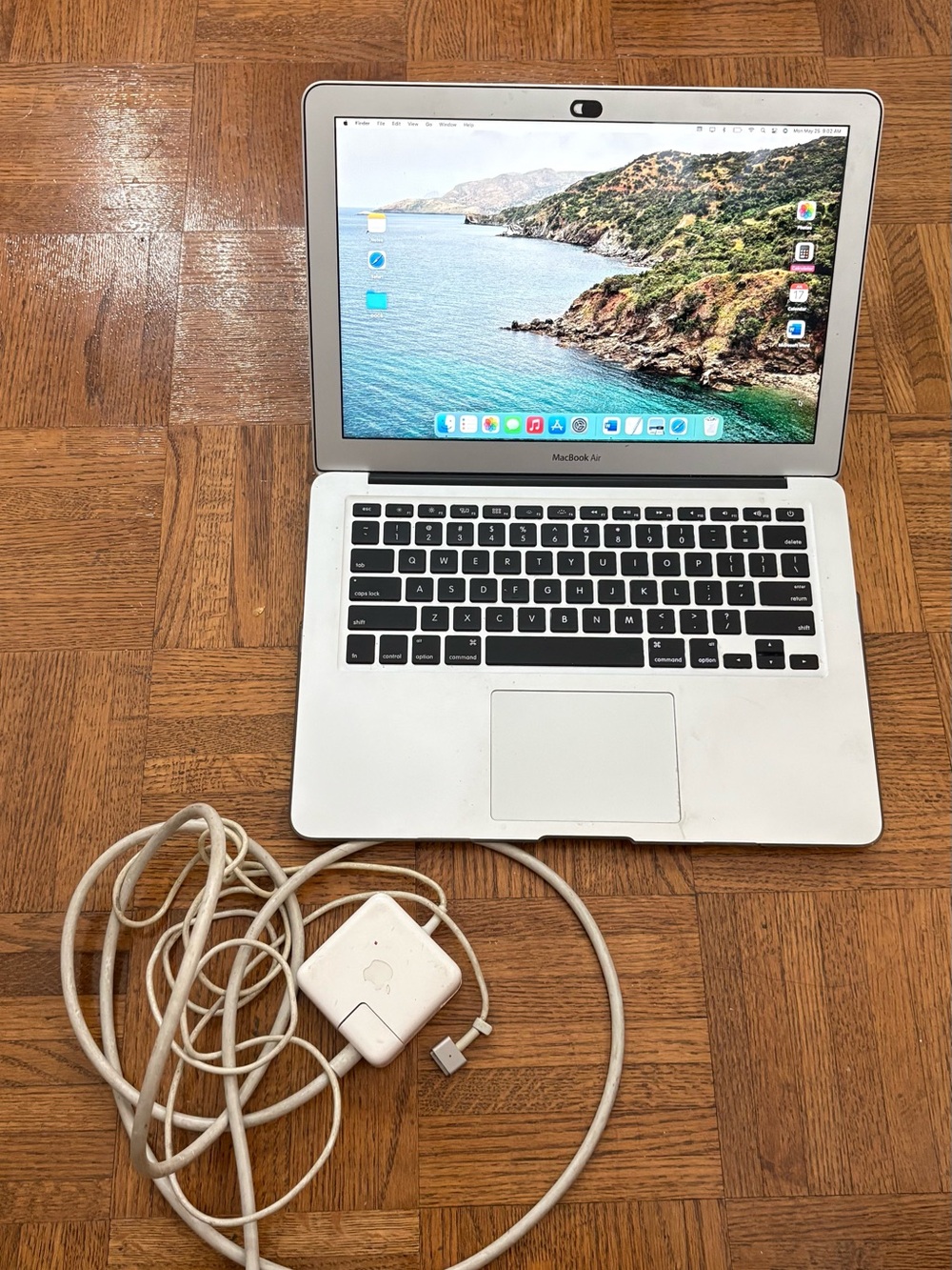 Apple MacBook Air in Silver with White Charger Cable
